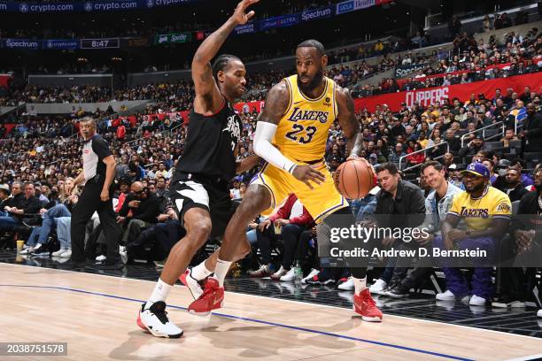 LeBron James of the Los Angeles Lakers dribbles the ball during the game against the LA Clippers on February 28, 2024 at Crypto.Com Arena in Los...