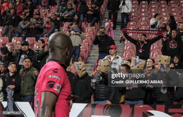 Tijuana's fans protest the team's performance by covering their heads with paper bags at the end of the Mexican Clausura tournament football match...