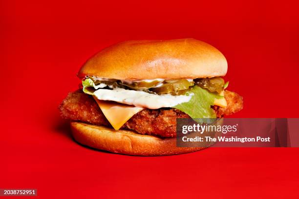 Wendy's Crispy Panko Fish Sandwich with wild caught Alaska pollock fillet coated in crispy panko breading topped with lettuce, a slice of American...