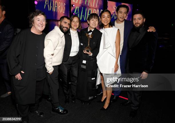 Christine Vachon, David Hinojosa, Pamela Koffler, Celine Song, winner of Best Director for "Past Lives," Greta Lee, Teo Yoo, and John Magaro pose...