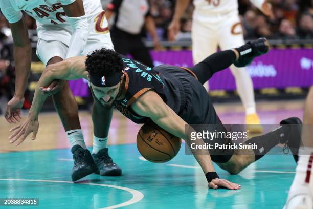 Landry Shamet of the Washington Wizards falls to the court as he tries to grab a loose ball against the Cleveland Cavaliers during the first half at...