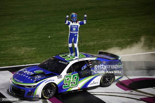 Daniel Suarez, driver of the Freeway Insurance Chevrolet, celebrates after winning the NASCAR Cup Series Ambetter Health 400 at Atlanta Motor...