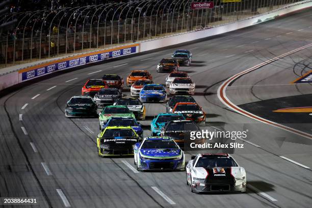 Ryan Blaney, driver of the BodyArmor Zero Sugar Ford, leads the field during the NASCAR Cup Series Ambetter Health 400 at Atlanta Motor Speedway on...