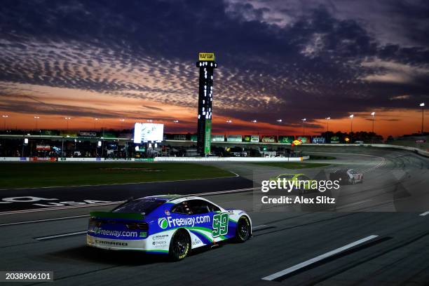 Daniel Suarez, driver of the Freeway Insurance Chevrolet, drives as the sunsets during the NASCAR Cup Series Ambetter Health 400 at Atlanta Motor...