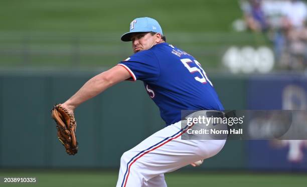 Jonathan Holder of the Texas Rangers delivers a pitch against the San Francisco Giants during a spring training game at Surprise Stadium on February...