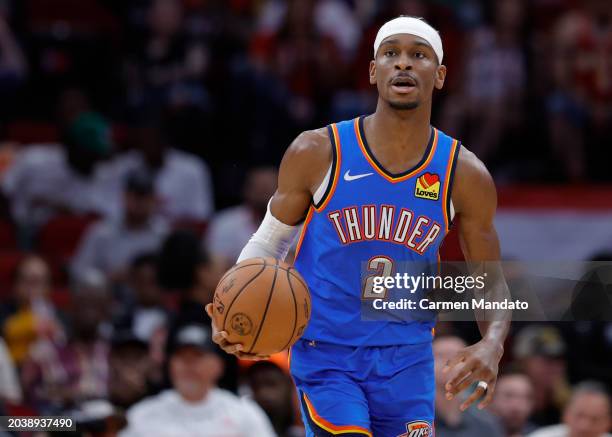 Shai Gilgeous-Alexander of the Oklahoma City Thunder controls the ball against the Houston Rockets during the first half at Toyota Center on February...