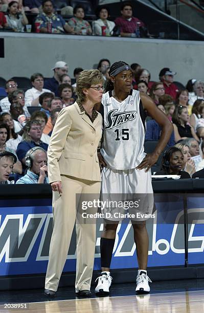 Head coach Candi Harvey and Adrienne Goodson of the San Antonio Stars stand on the sidelines during the WNBA game against the Seattle Storm at SBC...