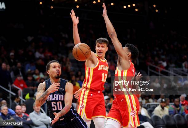 Cole Anthony of the Orlando Magic throws the ball up as he draws a foul from Kobe Bufkin of the Atlanta Hawks during the second quarter at State Farm...