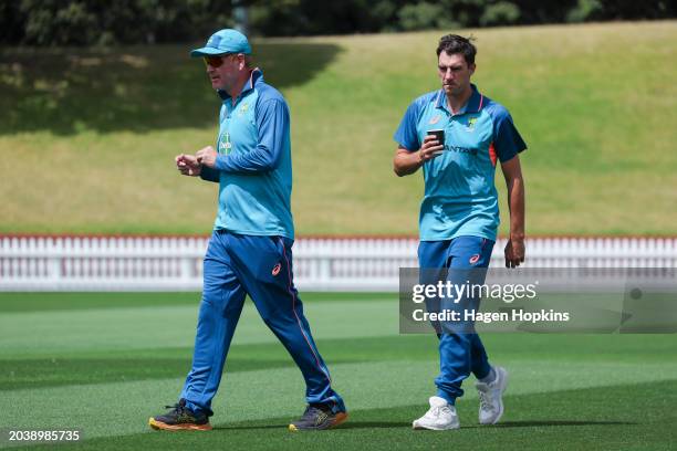 Coach Andrew McDonald and captain Pat Cummins of Australia look on during a training session ahead of the First Test in the series between New...