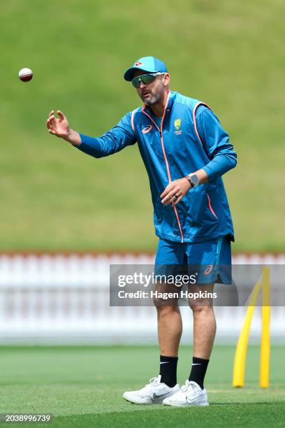 Nathan Lyon of Australia prepares to bowl during a training session ahead of the First Test in the series between New Zealand and Australia at Basin...