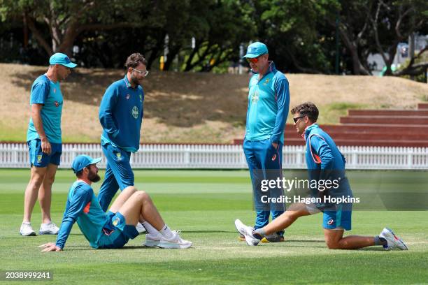 Coach Andrew McDonald of Australia talks to Scott Boland, Michael Neser and Alex Carey during a training session ahead of the First Test in the...