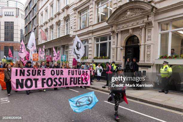 Climate activists from Extinction Rebellion march to Lloyds of London in protest against the role of the global insurance industry in supporting new...