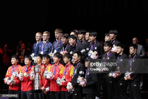 Gold medalists Team China, silver medalists Team France, bronze medalists Team Chinese Taipei and Team South Korea pose for a group photo after the...