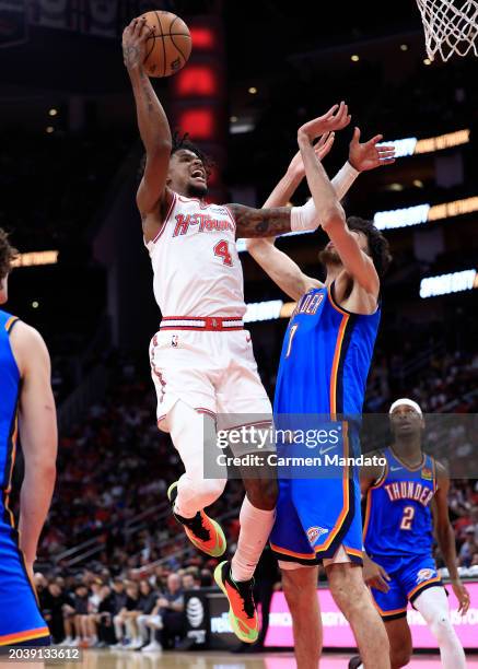 Jalen Green of the Houston Rockets drives to the net ahead of Chet Holmgren of the Oklahoma City Thunder during the second half at Toyota Center on...