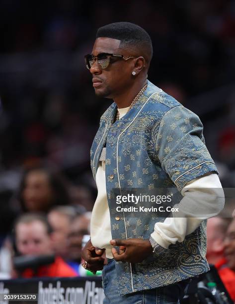 Rapper Boosie Badazz reacts during the second quarter between the Atlanta Hawks and the Orlando Magic at State Farm Arena on February 25, 2024 in...