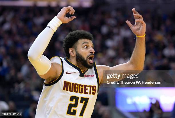 Jamal Murray of the Denver Nuggets reacts to a foul called on him while guarding Stephen Curry of the Golden State Warriors in the third quarter at...