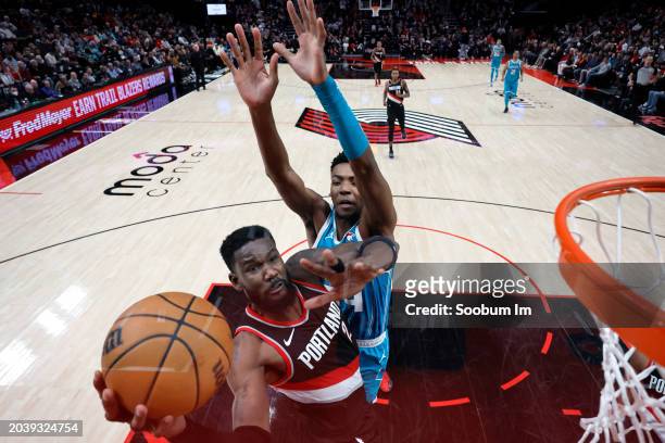 Deandre Ayton of the Portland Trail Blazers shoots under pressure from Brandon Miller of the Charlotte Hornets during the second half at Moda Center...