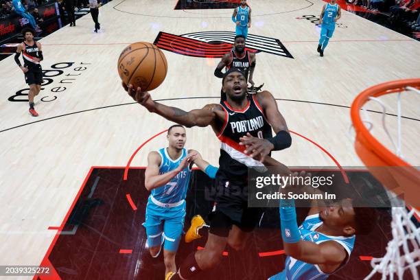 Jerami Grant of the Portland Trail Blazers shoots the ball against Brandon Miller of the Charlotte Hornets during the second half at Moda Center on...