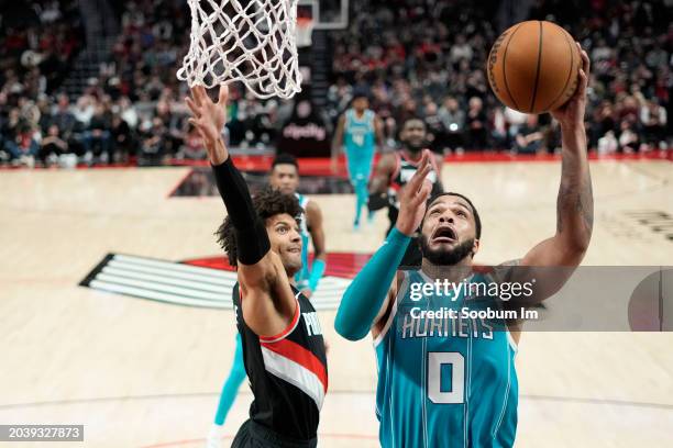 Miles Bridges of the Charlotte Hornets puts up a shot against Matisse Thybulle of the Portland Trail Blazers during the second half at Moda Center on...