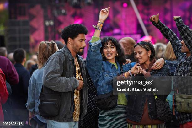cheerful couples and friends dancing to music - dancing stock pictures, royalty-free photos & images