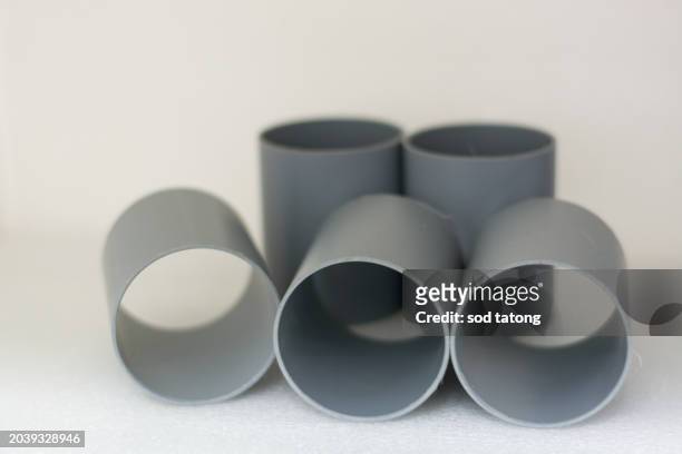 pipes stacked on top of each other representing industrial raw material commodities industry and business. - steel tubing stock pictures, royalty-free photos & images