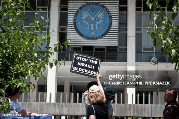 French and US Gaza flotilla activists demonstrate on July 1, 2011 in Athens outside the US embassy in Greece to protest against the blockage by...