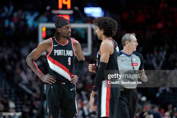 Jerami Grant and Matisse Thybulle of the Portland Trail Blazers talk during the second half against the Charlotte Hornets at Moda Center on February...