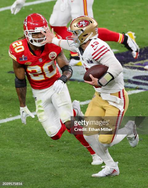 Quarterback Brock Purdy of the San Francisco 49ers runs against safety Justin Reid of the Kansas City Chiefs in the second quarter of Super Bowl...