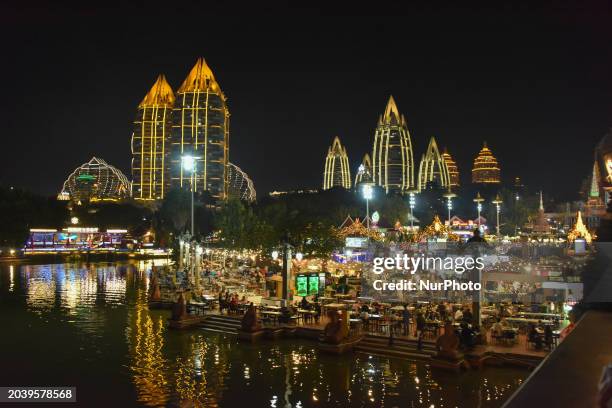 Tourists are visiting the Xingguang Night Market, the largest night market in Asia, in Xishuangbanna, Yunnan Province, China, on January 12, 2024.