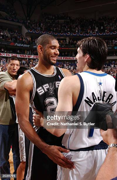 Tim Duncan of the San Antonio Spurs meets with Eduardo Najera of the Dallas Mavericks after Game six of the Western Conference Finals during the 2003...