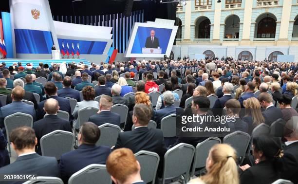 Russian President Vladimir Putin delivers an annual address to the Federal Assembly of the Russian Federation, at Moscow's Gostiny Dvor; the Federal...