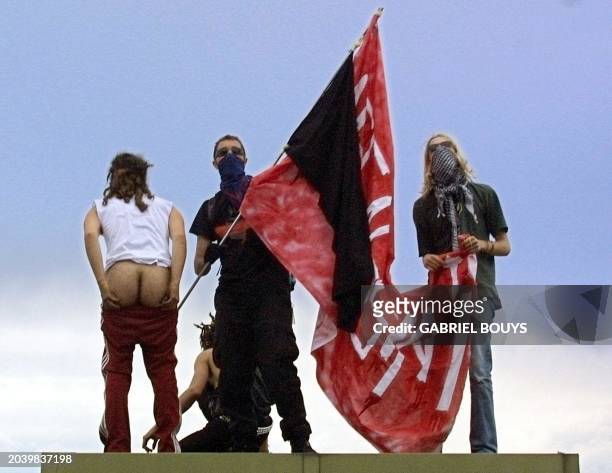 Anti-globalisation militant shows his bottom during a rally against the Group of Eight summit in Genoa 19 July 200. Leaders from the world's seven...