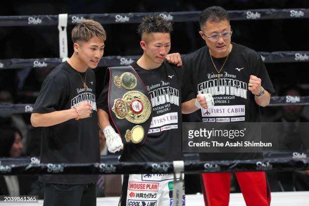 Takuma Inoue of Japan celebrates with his father and trainer Shingo and brother and boxer Naoya after the knockout victory over Jerwin Ancajas of the...