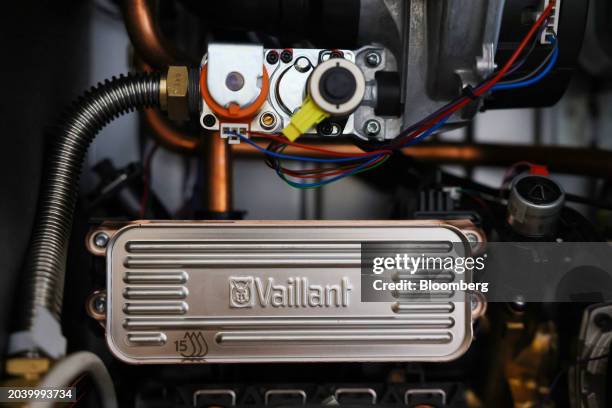 Gas valve and a heat plate exchanger during the installation of a boiler in London, UK, on Wednesday, Feb. 28, 2024. Debt owed to suppliers on energy...