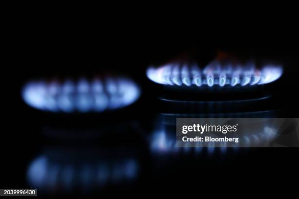 Gas burns on a domestic cooking hob inside a residential apartment in London, UK, on Wednesday, Feb. 28, 2024. Debt owed to suppliers on energy bills...