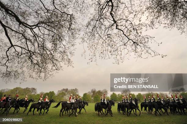 Members of the Lifeguards Household Cavalry Mounted Regiment gather during a rehearsal ahead of the Royal wedding of Britain's Prince William and...