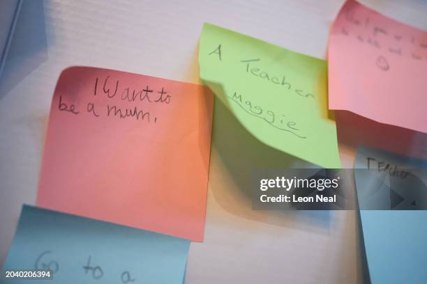 Notes written by primary school children about their future career aspirations, including one reading "I want to be a mum", are seen during the...
