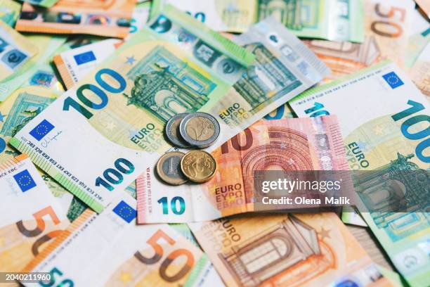 euro banknotes and coins. money background - euro geldschein stock-fotos und bilder