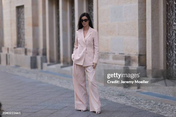 Leo Eberlin seen wearing YSL brown tortoise sunglasses, Leo Mathild diamond jewelry / rings and bracelet, Marc Cain light pink elegant blazer jacket,...