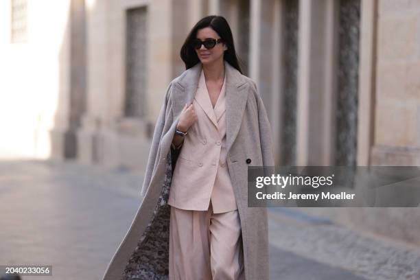 Leo Eberlin seen wearing YSL brown tortoise sunglasses, Leo Mathild diamond jewelry / rings and bracelet, Marc Cain light pink elegant blazer jacket,...