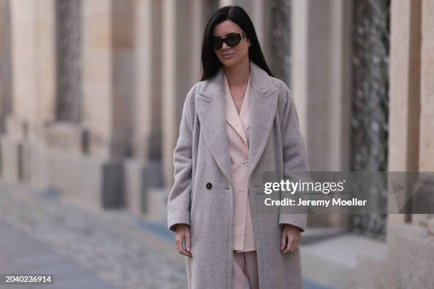 Leo Eberlin seen wearing YSL brown tortoise sunglasses, Leo Mathild diamond jewelry / rings and bracelet, Marc Cain light pink elegant blazer jacket,...