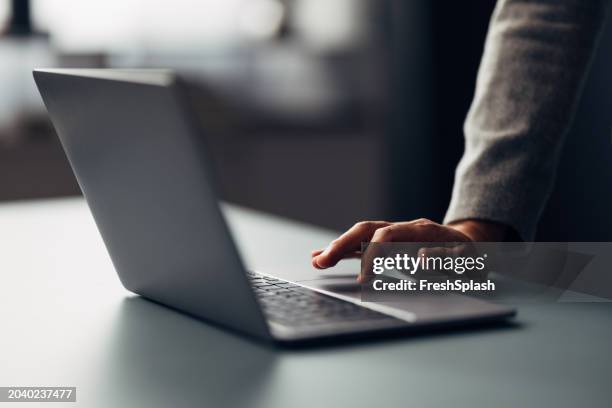 close-up of a professional working on laptop in modern office - styrplatta bildbanksfoton och bilder