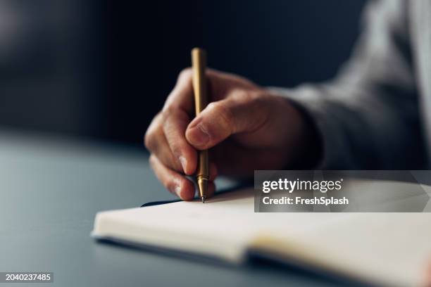 close-up of hand writing in notebook with luxury pen, focus on writing - dear diary stock pictures, royalty-free photos & images