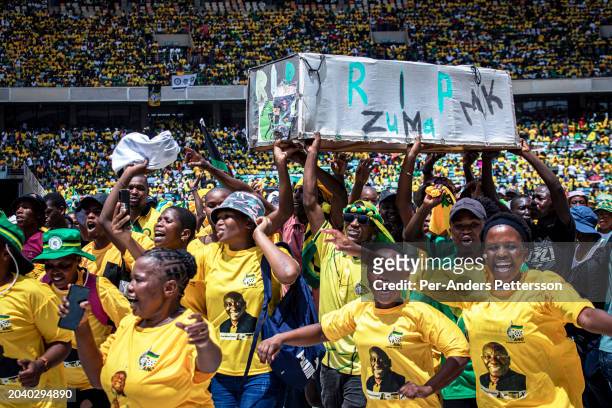 African National Congress supporters carry a mock coffin of former ANC President Jacob Zuma's new party, Umkhonto We Sizwe during the ANC Election...