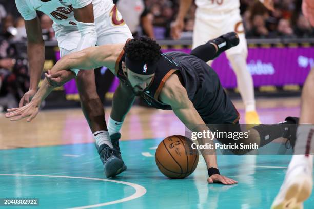 Landry Shamet of the Washington Wizards falls to the court as he tries to grab a loose ball against the Cleveland Cavaliers during the first half at...