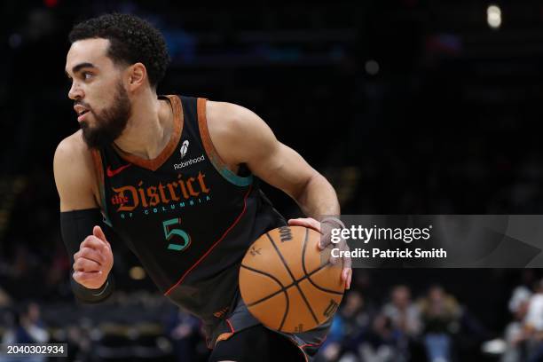 Tyus Jones of the Washington Wizards dribbles against the Cleveland Cavaliers at Capital One Arena on February 25, 2024 in Washington, DC. NOTE TO...