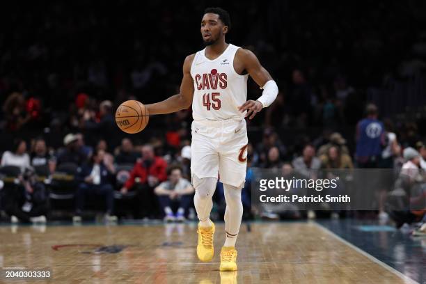 Donovan Mitchell of the Cleveland Cavaliers dribbles the ball up court against the Washington Wizards at Capital One Arena on February 25, 2024 in...