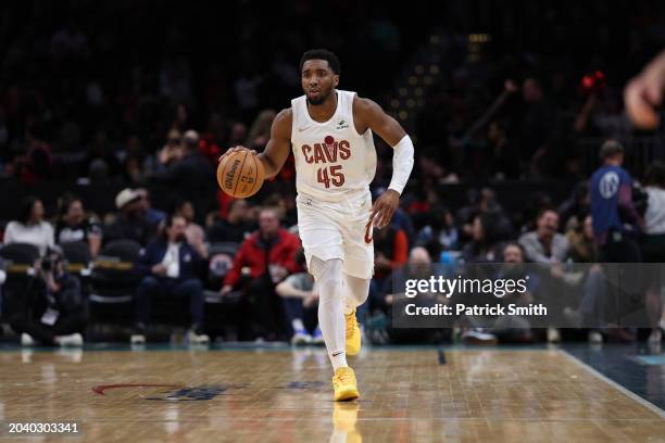 Donovan Mitchell of the Cleveland Cavaliers dribbles the ball up court against the Washington Wizards at Capital One Arena on February 25, 2024 in...