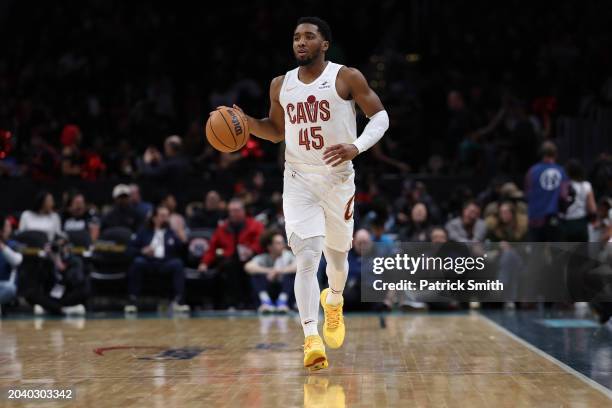 Donovan Mitchell of the Cleveland Cavaliers dribbles the ball up court against the Washington Wizards at Capital One Arena on February 25, 2024 in...