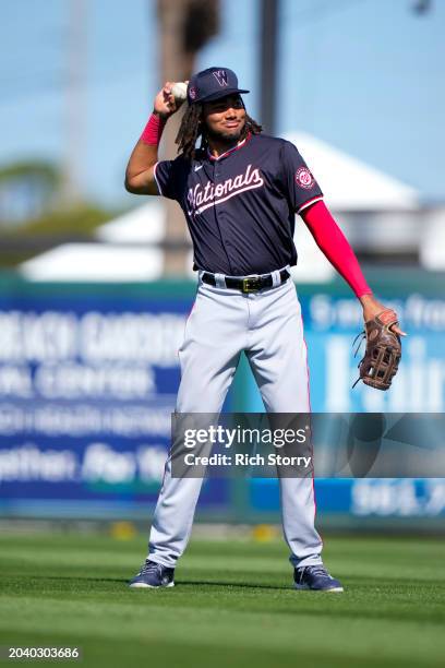 James Wood of the Washington Nationals looks on against the Miami Marlins during a spring training game at Roger Dean Stadium on February 25, 2024 in...